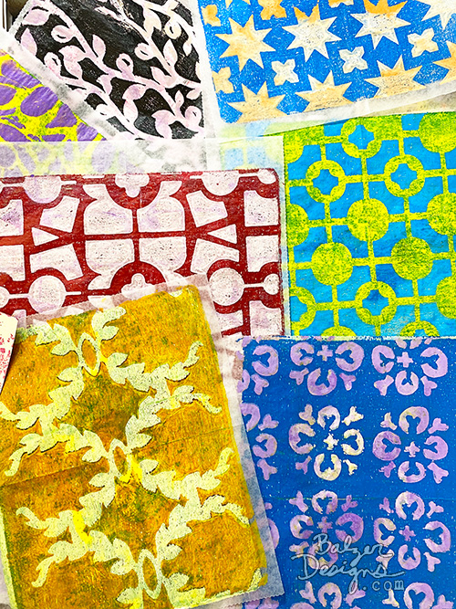 Several gelatin printed papers using stencil designs.