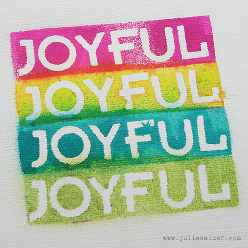 The word "joyful" four times in a stack of colorful spray ink boxes.