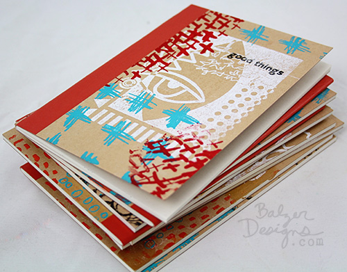 Stack of notebooks with decorated covers.